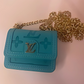 LV inspired AirPod case in teal